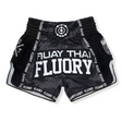 Black Muay Thai shorts with white text on a white background