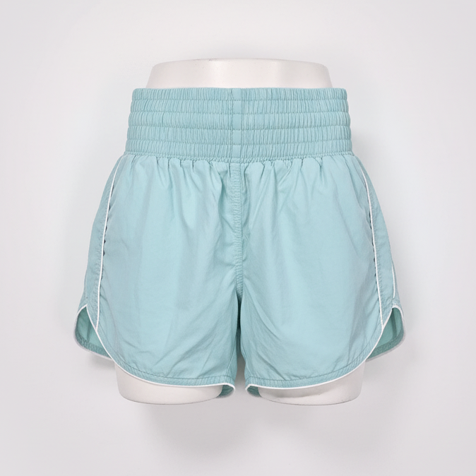 Light blue shorts on a white mannequin against a white background